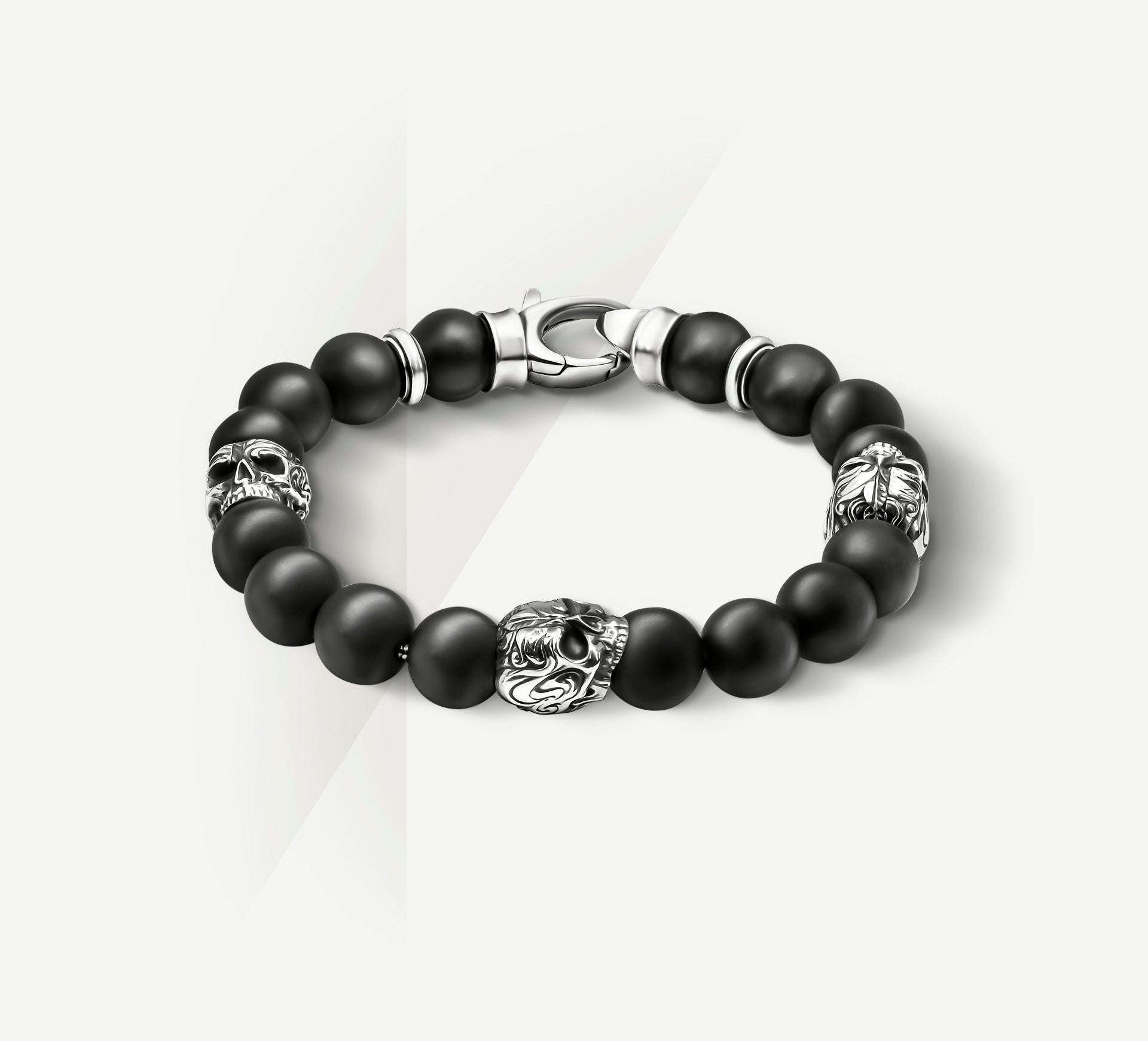 10mm Black Onyx Bead Bracelet<br>w/Sterling Silver Skulls