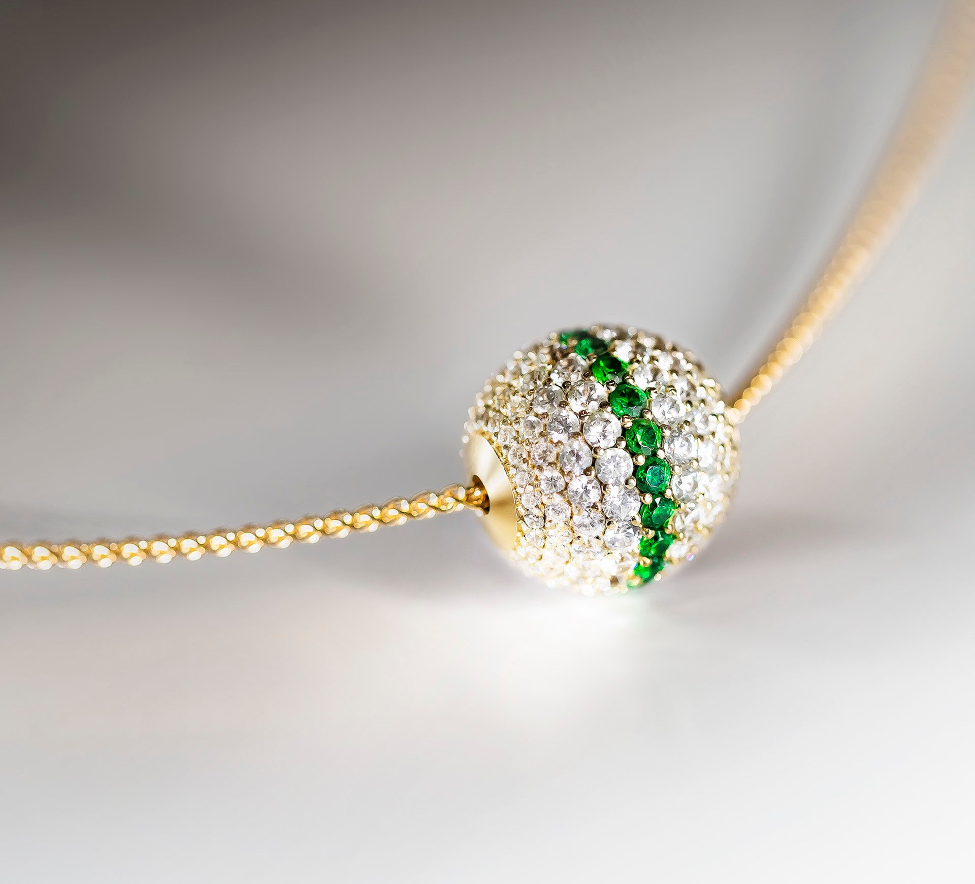 Radiant Gold Sphere Necklace<br>w/White Pavé Diamonds<br>& Emerald Accent