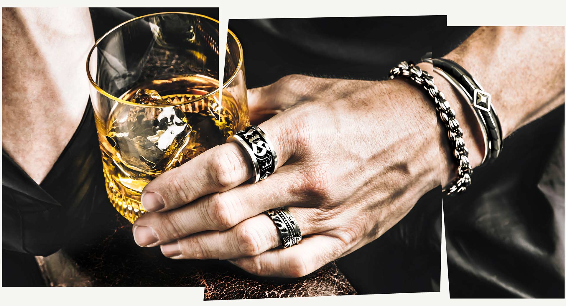 Man holding whiskey drink with rings on fingers