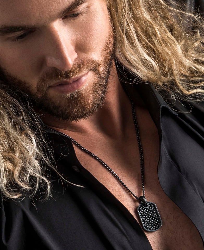 color image of a man wearing a black necklace